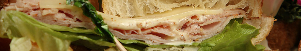 Eating Deli Sandwich at Funaro's Deli restaurant in Indianola, IA.